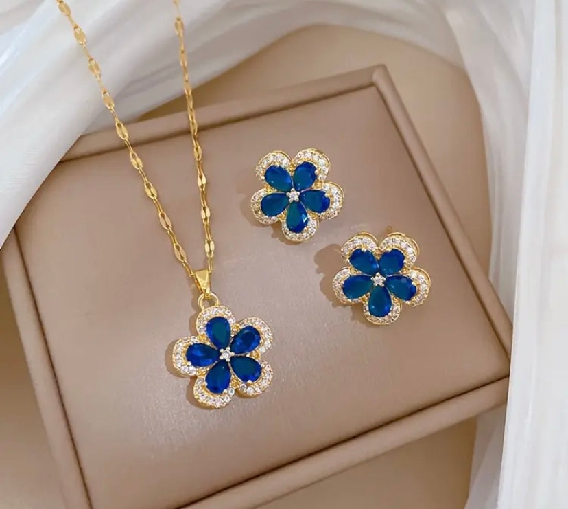 Gold colored blue flower pendant and earrings set