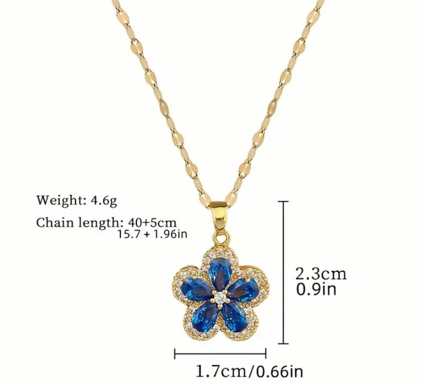 Gold colored blue flower pendant and earrings set