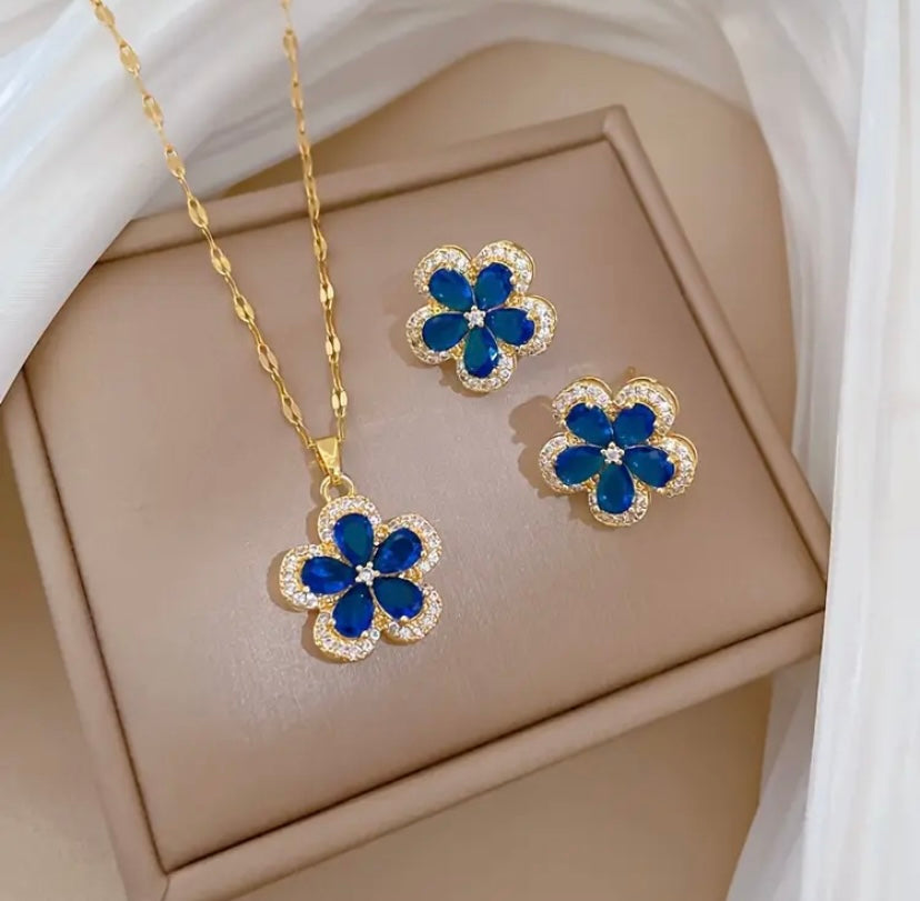 Gold colored blue flower pendant and earrings set