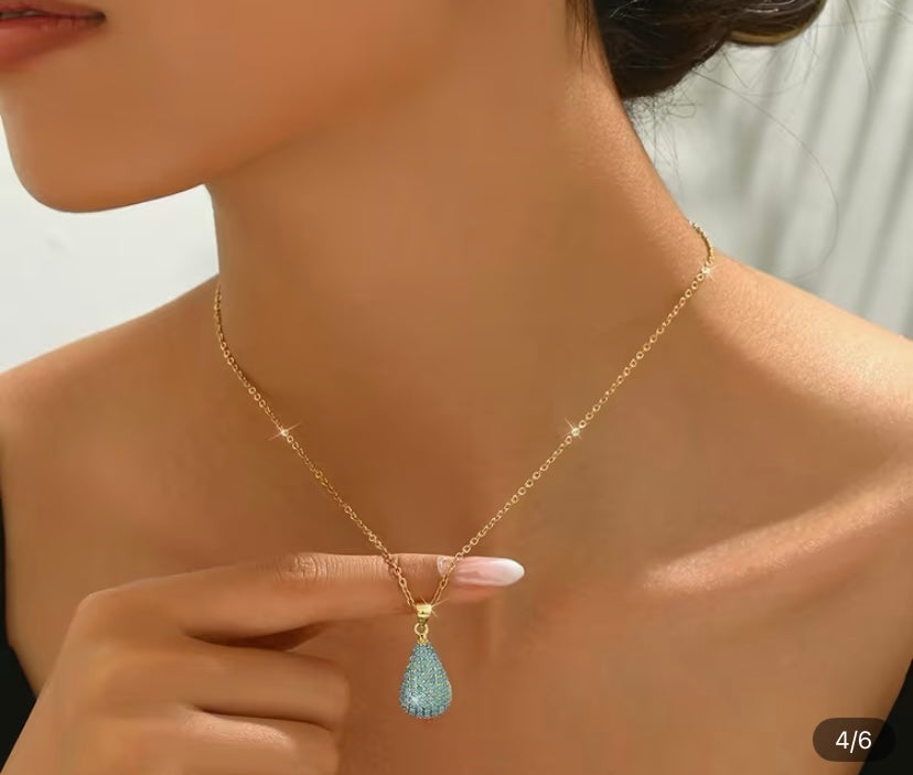 Gold colored turquoise necklace and earring set